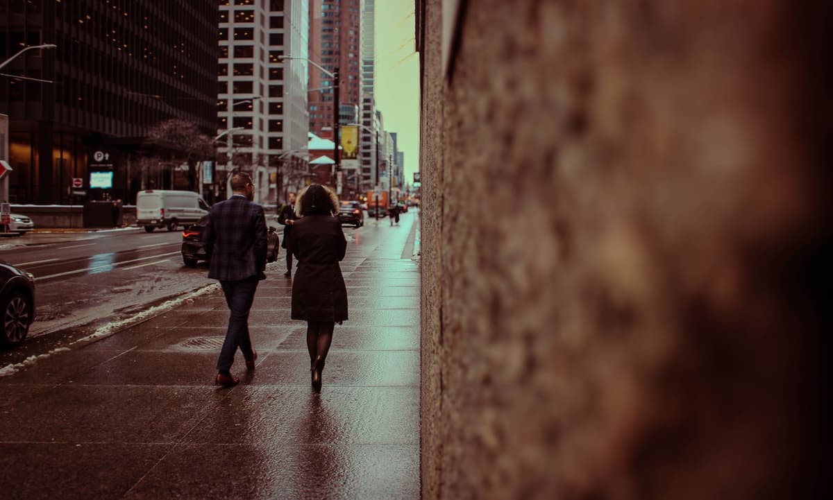 A couple walking together through a city street