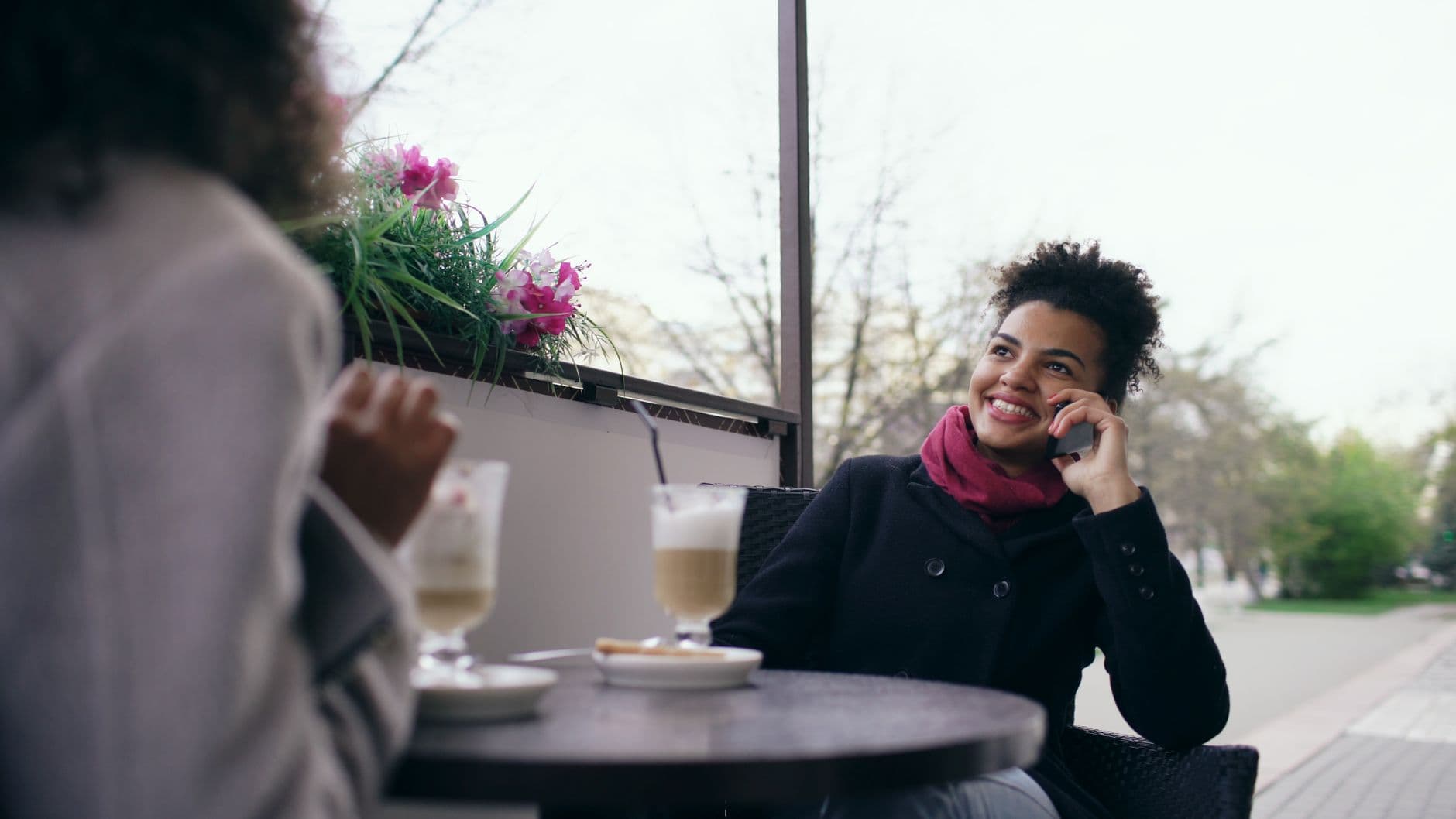 Friends in warm conversation over coffee