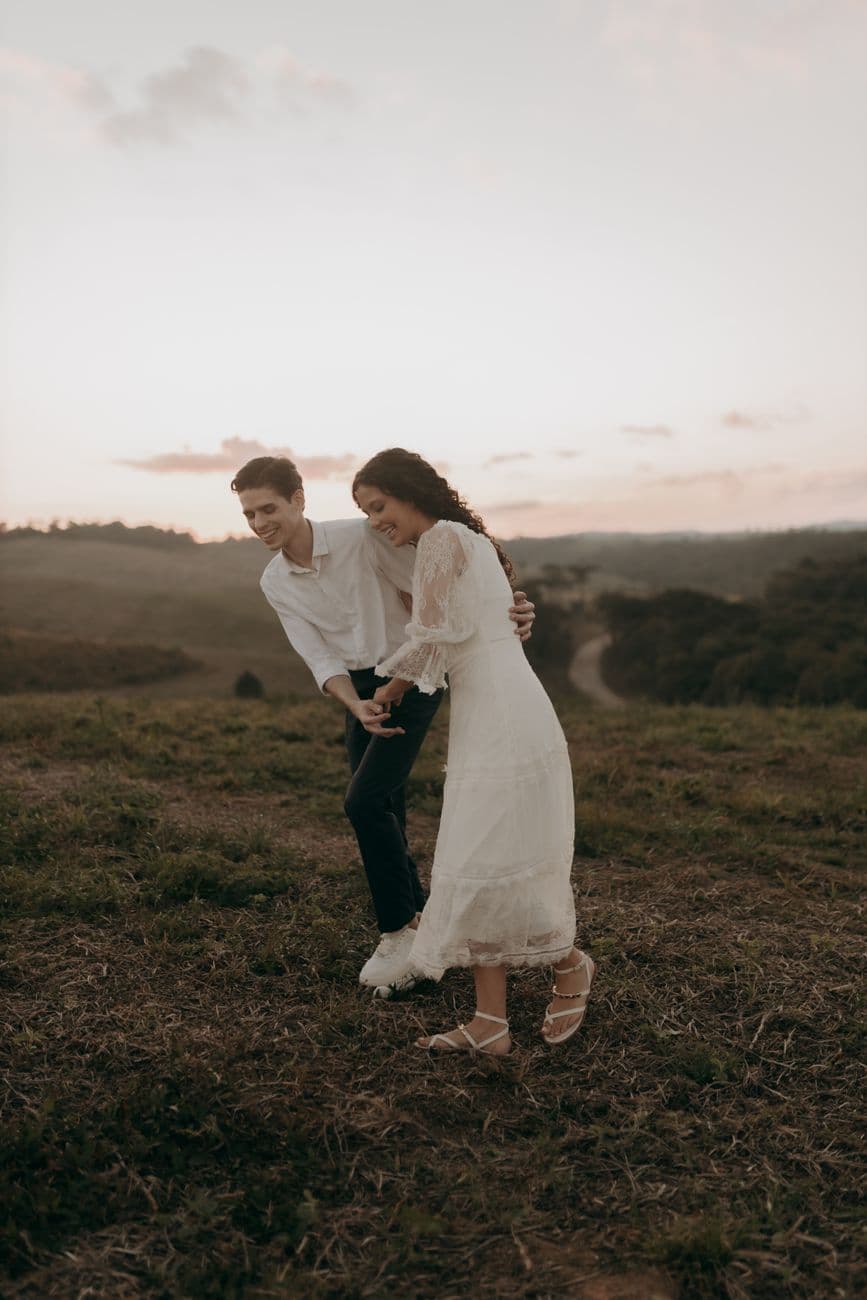 A couple laughing together in golden evening light